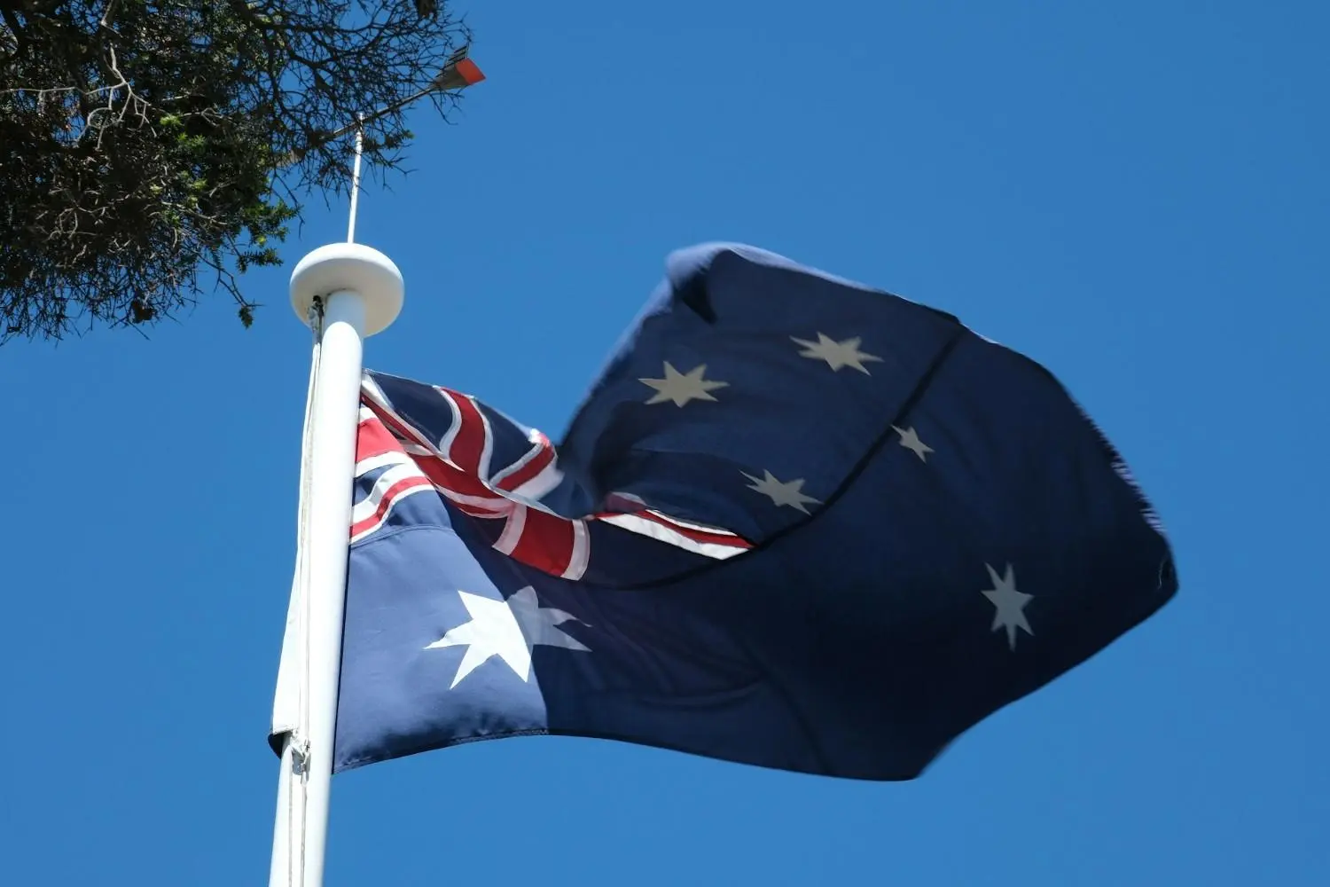 Australia flag with blue sky background